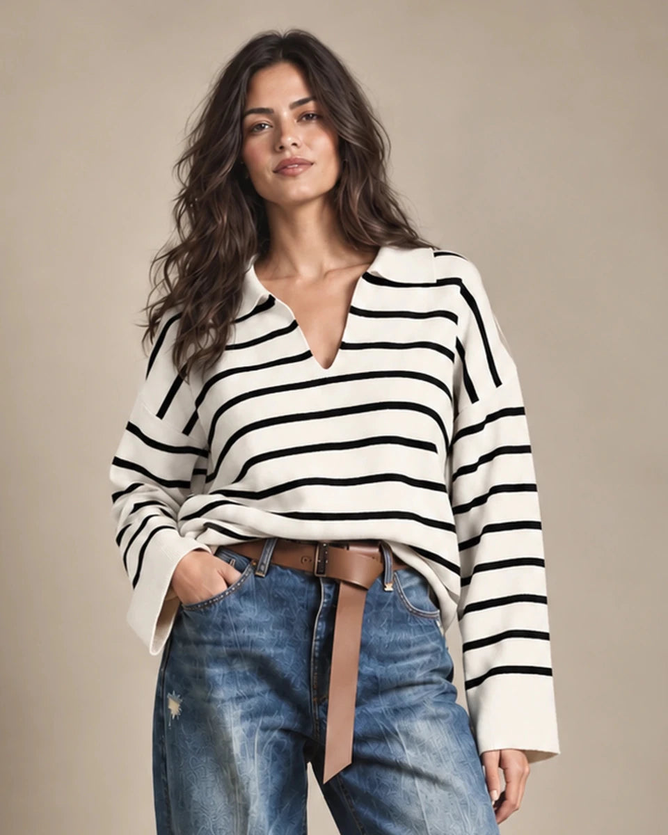 Close-up of the Rossana knit sweater with black horizontal stripes on a cream base and an open polo-style collar.