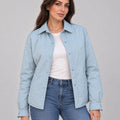 Front view of the pale blue Sky Mist Windbreaker Jacket worn open over a white top and jeans, showing the collar and snap fastenings.