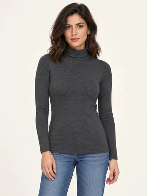 Dark mélange grey stretch-blend turtleneck long-sleeve top worn untucked with blue jeans, front view