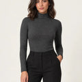 Dark mélange grey stretch-blend turtleneck long-sleeve top styled with black trousers, front view
