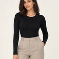Black stretch-cotton crew-neck long-sleeve top styled with stone tailored trousers, front view