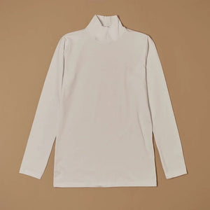 White stretch-cotton mock-neck long-sleeve top laid flat, front view