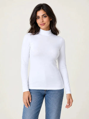 White stretch-cotton mock-neck long-sleeve top worn untucked with blue jeans, front view