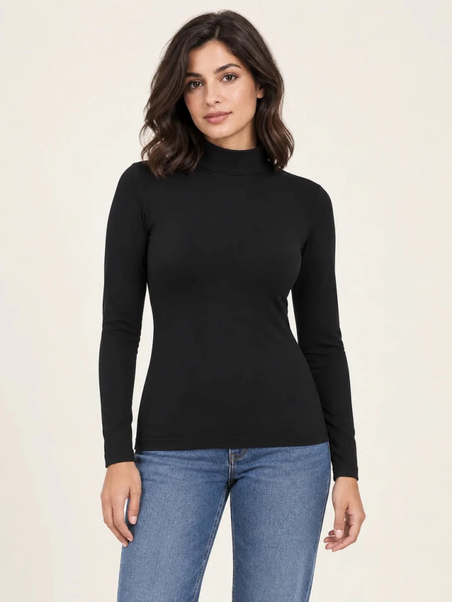 Black stretch-cotton mock-neck long-sleeve top worn untucked with blue jeans, front view