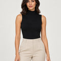 Black stretch-cotton sleeveless mock-neck top styled with stone trousers, front view