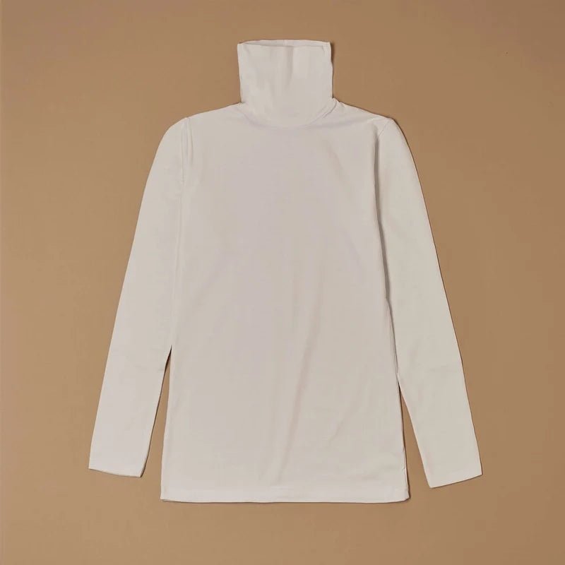 White stretch-cotton turtleneck long-sleeve top laid flat, front view