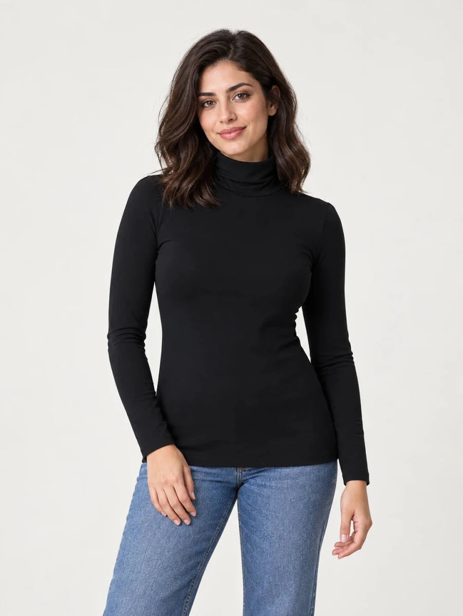 Black stretch-cotton turtleneck long-sleeve top worn untucked with blue jeans, front view