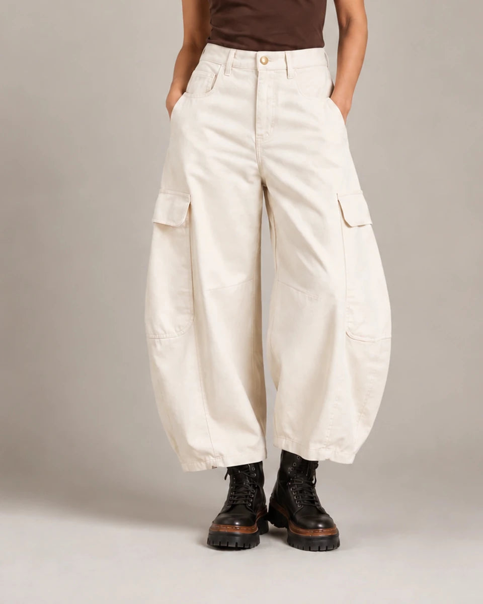 Front detail of the ivory Vittoria Panna Cargo Balloon Trousers showing the waistband, flap cargo pockets and curved balloon legs.