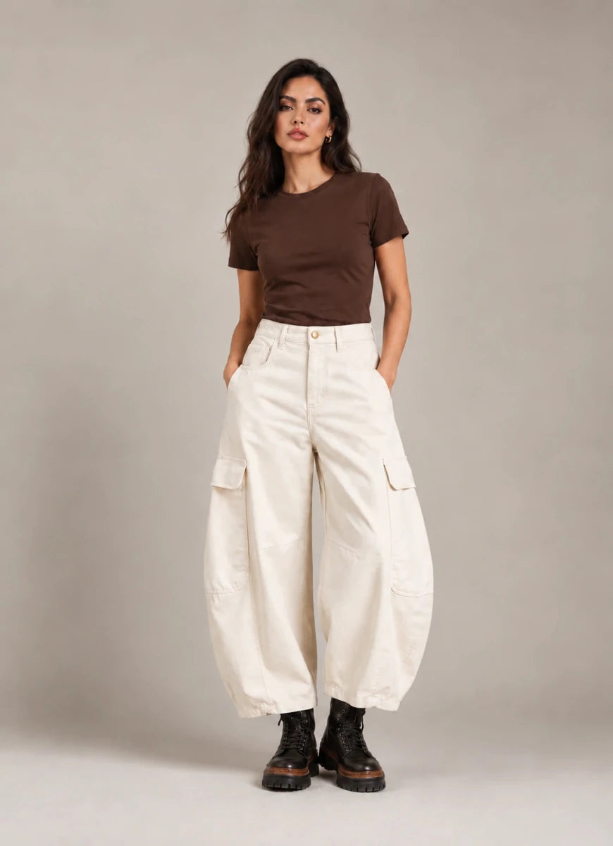 Full-length front view of the ivory Vittoria Panna Cargo Balloon Trousers, worn with a brown T-shirt and black ankle boots.