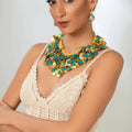 18 karat gold plated brass necklace, adorned with gold leaf and turquoise colored antiqued coins - ELLY