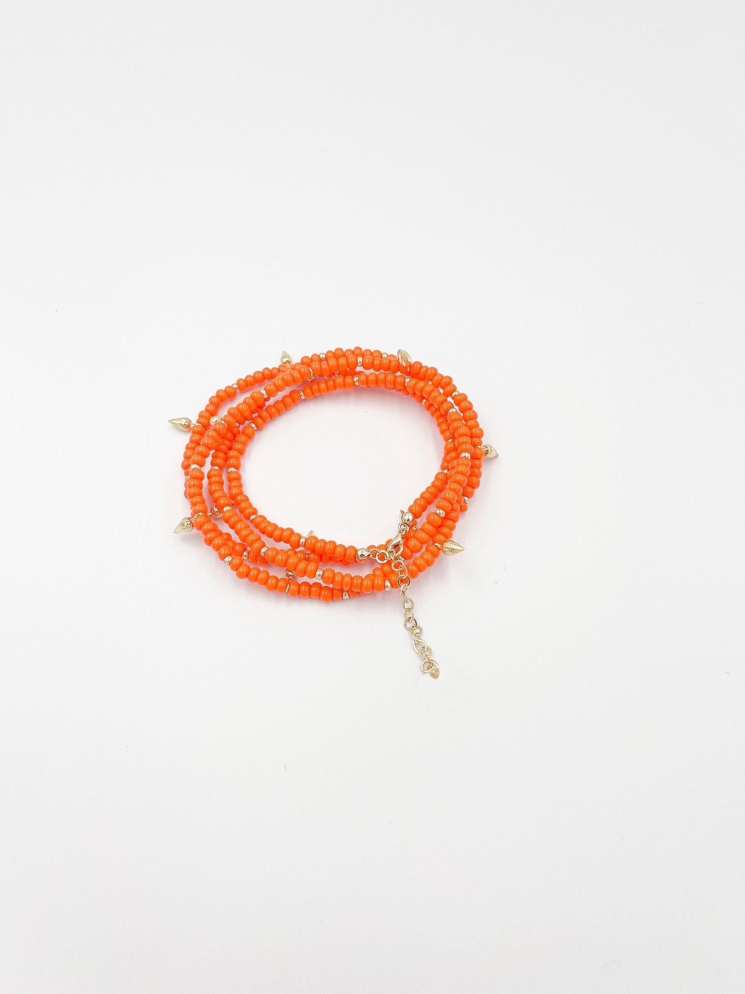 Beads necklace featuring 18 karat gold plated ornaments that can be styled as a bracelet or belt. - ELLY